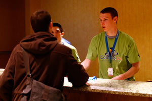 ConFoo volunteer at the registration desk